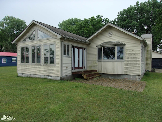 2221 N Channel Dr, Harsens Island, MI 48028 - view of front of property with entry steps, french doors, a front lawn, and crawl space