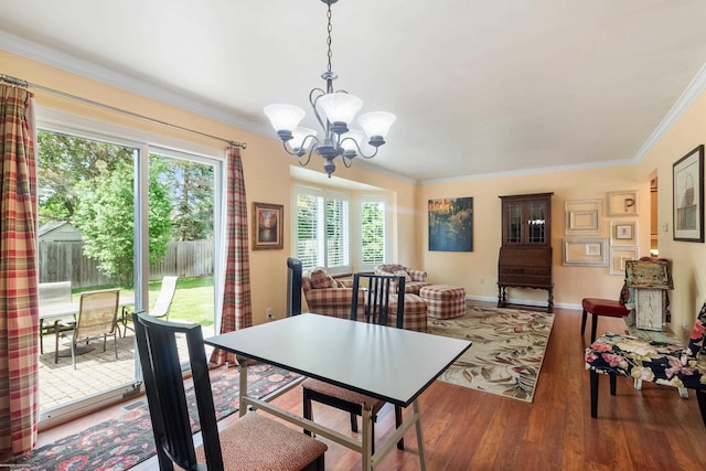 3667 Alderdale Dr, Sterling Heights, MI 48310 - dining space featuring a chandelier, crown molding, and wood finished floors