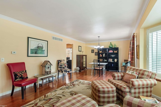 3667 Alderdale Dr, Sterling Heights, MI 48310 - living area featuring a chandelier, wood finished floors, and ornamental molding
