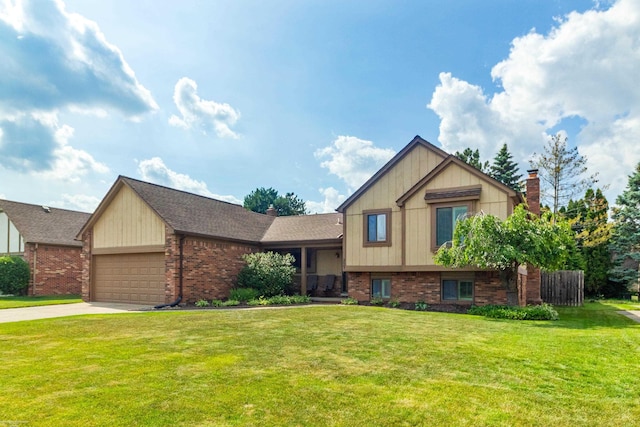 3667 Alderdale Dr, Sterling Heights, MI 48310 - view of front of property featuring brick siding, an attached garage, a front lawn, concrete driveway, and a chimney
