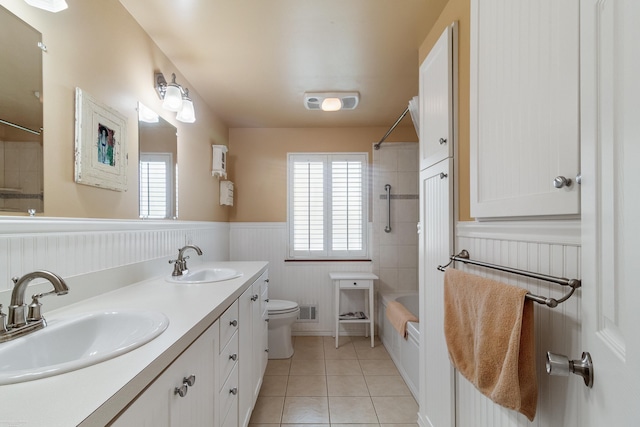 3667 Alderdale Dr, Sterling Heights, MI 48310 - bathroom with wainscoting, double vanity, bathing tub / shower combination, and tile patterned floors