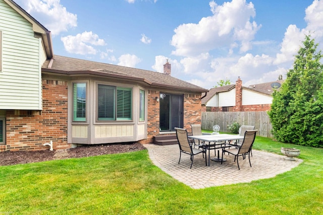 3667 Alderdale Dr, Sterling Heights, MI 48310 - rear view of property with brick siding, a patio, a chimney, and entry steps