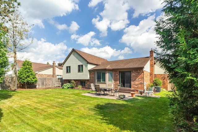 3667 Alderdale Dr, Sterling Heights, MI 48310 - back of house with a chimney, a patio area, brick siding, and a shingled roof