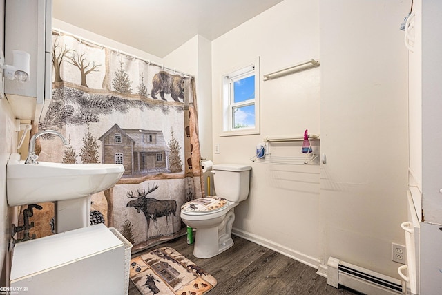 6920 Snover Rd, Decker, MI 48426 - bathroom with baseboard heating, wood finished floors, and a shower with shower curtain