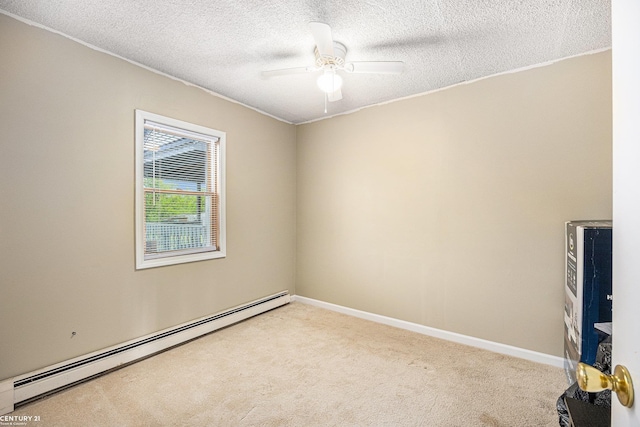 6920 Snover Rd, Decker, MI 48426 - empty room featuring a baseboard heating unit, light colored carpet, a ceiling fan, and a textured ceiling