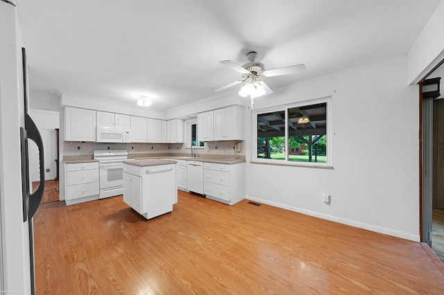 19300 Briarwood St, Clinton Township, MI 48036 - kitchen with white appliances, a center island, white cabinets, a ceiling fan, and light wood-style flooring