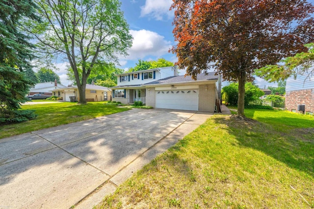 19300 Briarwood St, Clinton Township, MI 48036 - traditional home with an attached garage, concrete driveway, brick siding, and a front yard