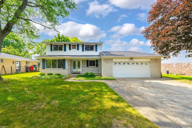 19300 Briarwood St, Clinton Township, MI 48036 - traditional home featuring brick siding, an attached garage, and driveway