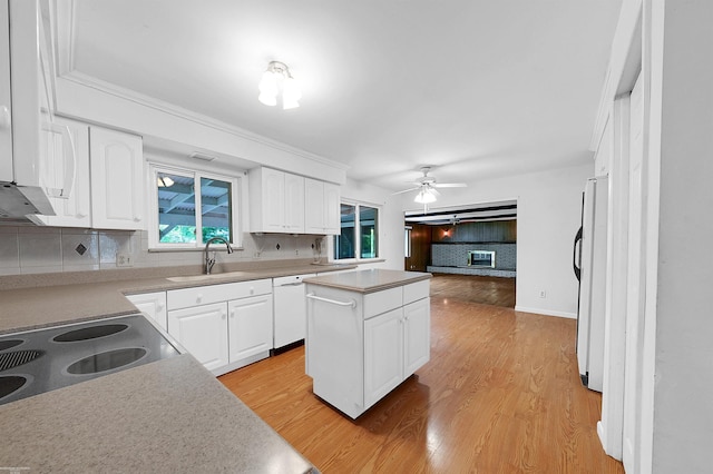 19300 Briarwood St, Clinton Township, MI 48036 - kitchen featuring refrigerator, dishwasher, decorative backsplash, and white cabinetry