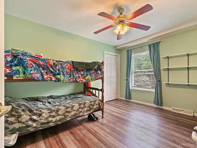 8302 W Burntwood P.15 Dr, Gladstone, MI 49837 - bedroom with hardwood / wood-style flooring and a ceiling fan