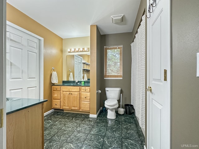 8302 W Burntwood P.15 Dr, Gladstone, MI 49837 - bathroom featuring vanity and baseboards