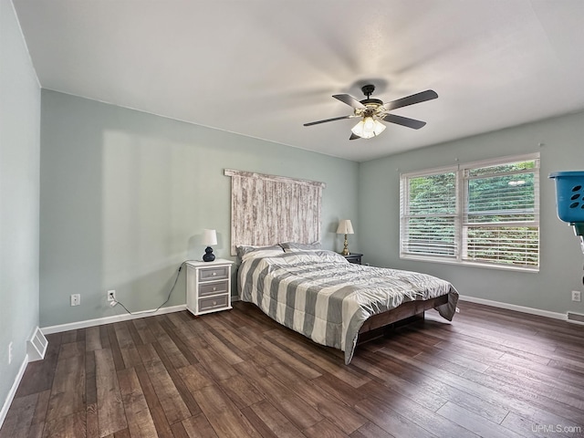8302 W Burntwood P.15 Dr, Gladstone, MI 49837 - bedroom featuring dark wood-type flooring and a ceiling fan