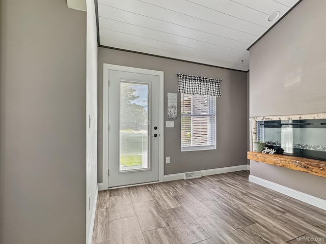 8302 W Burntwood P.15 Dr, Gladstone, MI 49837 - doorway featuring wood finish floors and baseboards