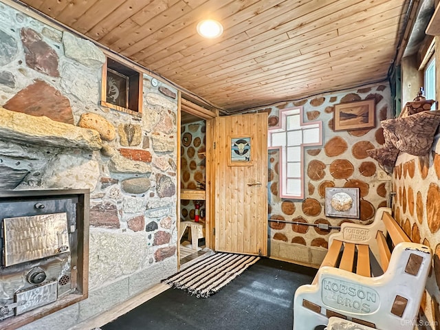 8302 W Burntwood P.15 Dr, Gladstone, MI 49837 - interior space featuring wood ceiling and a fireplace