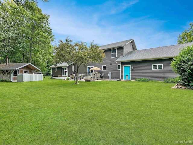 8302 W Burntwood P.15 Dr, Gladstone, MI 49837 - back of house with a lawn and an outbuilding