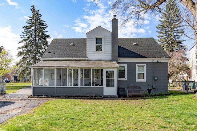 1006 W 12 Mile Rd, Royal Oak, MI 48073 - back of house with a sunroom, a chimney, and roof with shingles