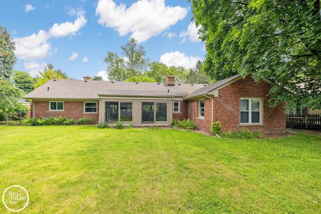 1033 Cadieux Rd, Grosse Pointe, MI 48230 - rear view of property with brick siding and a chimney