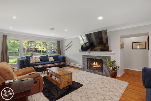 1033 Cadieux Rd, Grosse Pointe, MI 48230 - living room featuring a baseboard heating unit, ornamental molding, wood finished floors, a fireplace with flush hearth, and recessed lighting