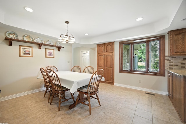 5350 Fieldcrest Dr, Shelby Twp, MI 48316 - dining space with recessed lighting, a chandelier, and a tray ceiling