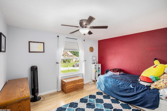 46329 Community Center Dr, Chesterfield Twp, MI 48047 - bedroom with wood finished floors and a ceiling fan