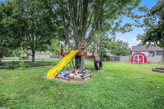 46329 Community Center Dr, Chesterfield Twp, MI 48047 - fenced backyard with a playground and a storage unit