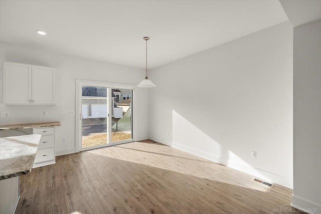 1718 W 12 Mile Rd, Royal Oak, MI 48073 - unfurnished dining area featuring wood finished floors and recessed lighting