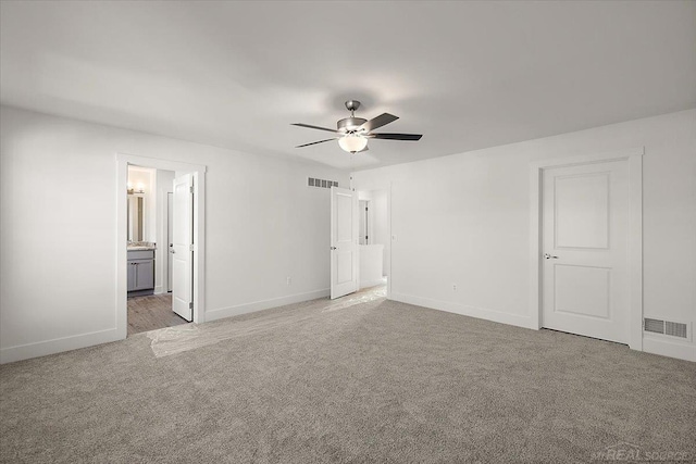 1718 W 12 Mile Rd, Royal Oak, MI 48073 - unfurnished bedroom with light carpet, ensuite bathroom, and a ceiling fan