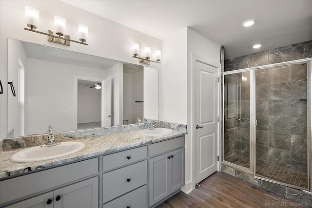 1718 W 12 Mile Rd, Royal Oak, MI 48073 - bathroom featuring a shower stall, double vanity, wood finished floors, a ceiling fan, and recessed lighting