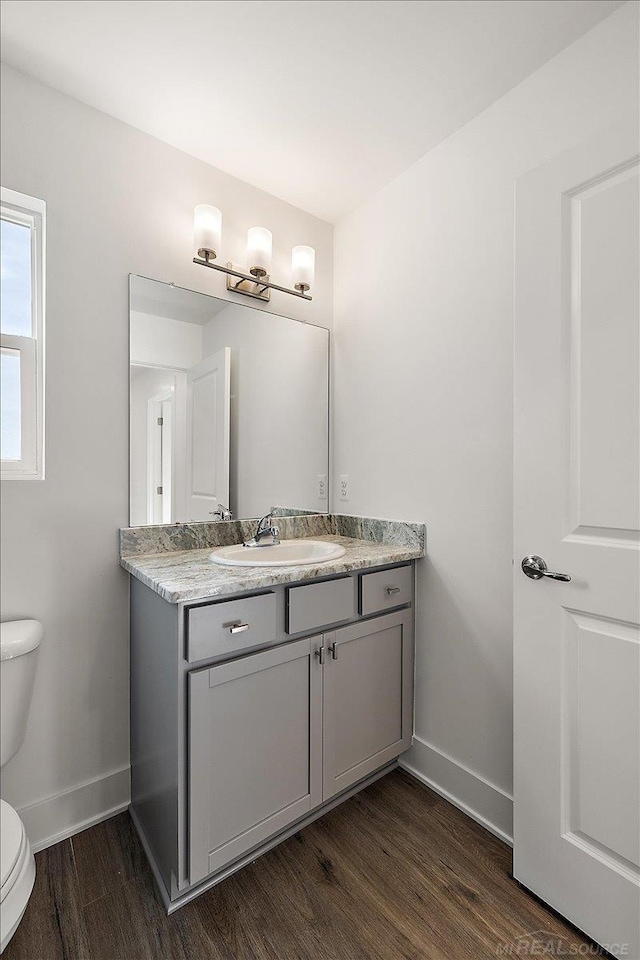 1718 W 12 Mile Rd, Royal Oak, MI 48073 - bathroom with vanity and wood finished floors