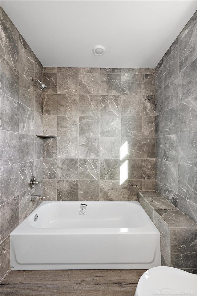 1718 W 12 Mile Rd, Royal Oak, MI 48073 - bathroom featuring wood finished floors and tub / shower combination