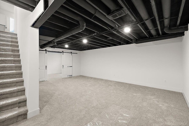 1718 W 12 Mile Rd, Royal Oak, MI 48073 - finished below grade area featuring stairway, a barn door, and carpet