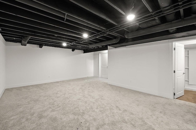 1718 W 12 Mile Rd, Royal Oak, MI 48073 - finished below grade area featuring light carpet and baseboards