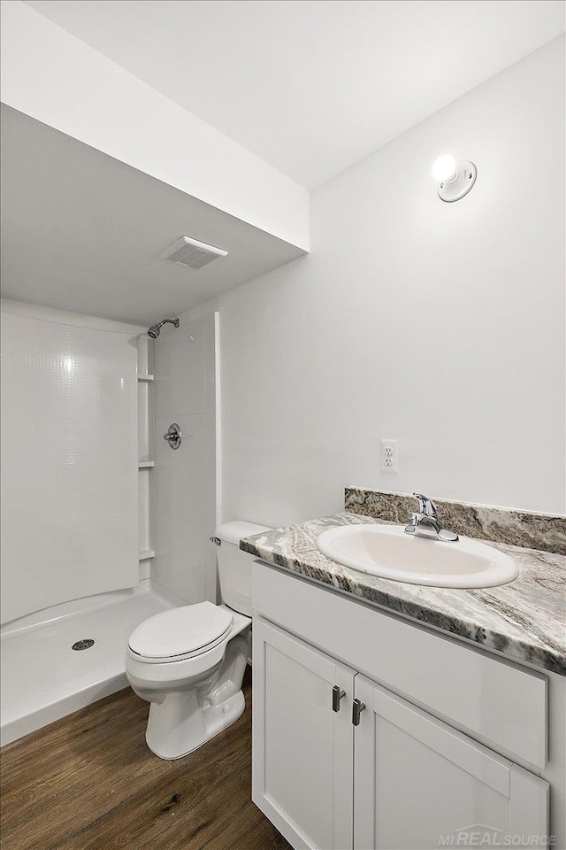 1718 W 12 Mile Rd, Royal Oak, MI 48073 - full bath featuring vanity, a shower, and wood finished floors