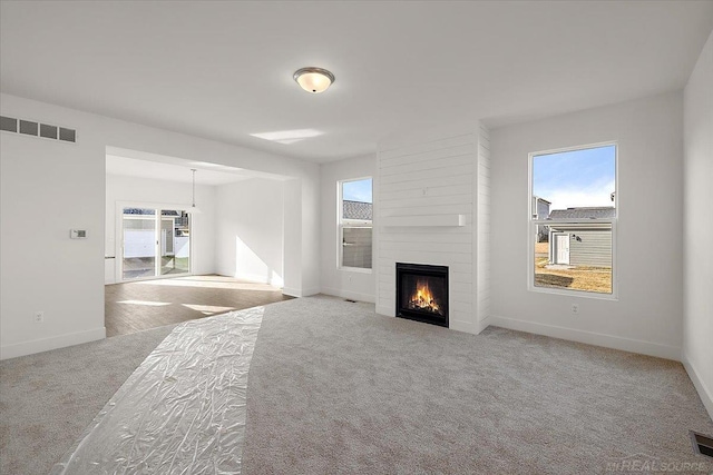 1718 W 12 Mile Rd, Royal Oak, MI 48073 - unfurnished living room with carpet floors and a fireplace