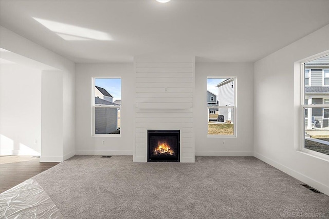 1718 W 12 Mile Rd, Royal Oak, MI 48073 - unfurnished living room featuring a fireplace and carpet floors