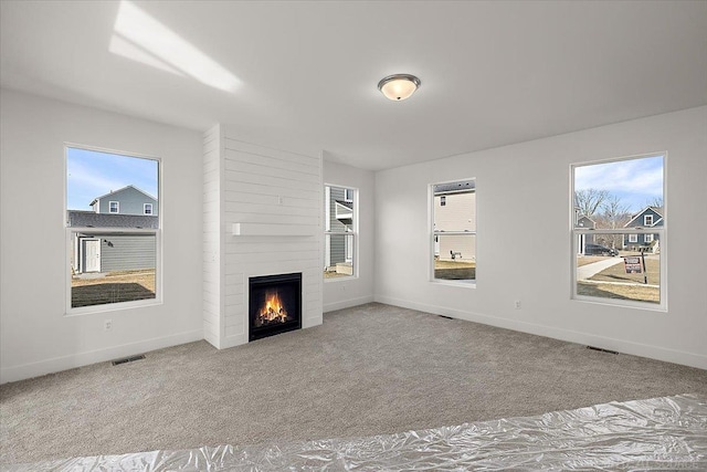 1718 W 12 Mile Rd, Royal Oak, MI 48073 - unfurnished living room featuring carpet floors and a fireplace