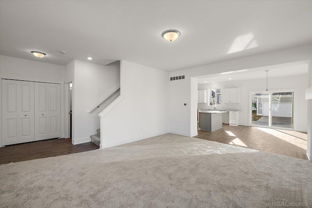 1718 W 12 Mile Rd, Royal Oak, MI 48073 - unfurnished living room with carpet, stairs, and recessed lighting