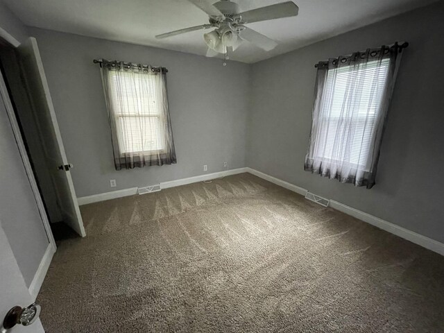 3366 L And L Ct, Bay City, MI 48706 - carpeted empty room with plenty of natural light and a ceiling fan