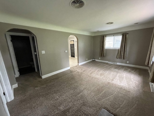 3366 L And L Ct, Bay City, MI 48706 - empty room with arched walkways and carpet floors