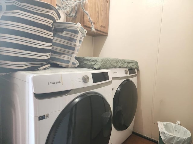 811 N Old State Ave, Harrison, MI 48625 - laundry area with cabinet space and washing machine and clothes dryer