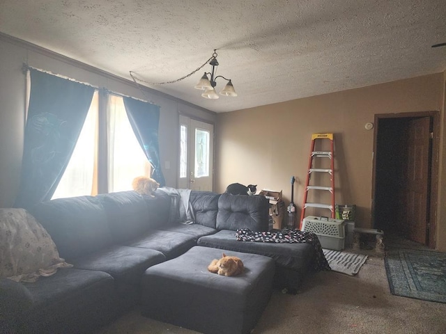 811 N Old State Ave, Harrison, MI 48625 - carpeted living area with a textured ceiling and a chandelier