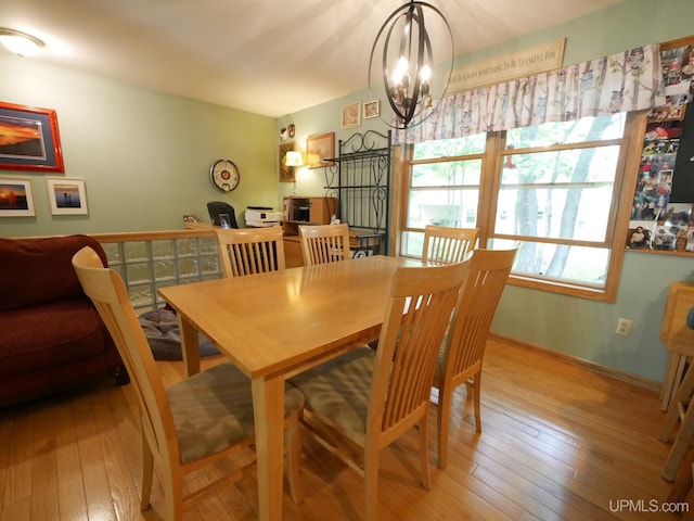 2004 Hunters Ln, Houghton, MI 49931 - dining area featuring a chandelier and light wood-type flooring