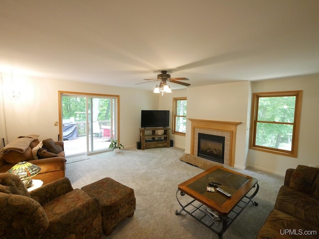 2004 Hunters Ln, Houghton, MI 49931 - living room with carpet flooring, healthy amount of natural light, a tile fireplace, and ceiling fan
