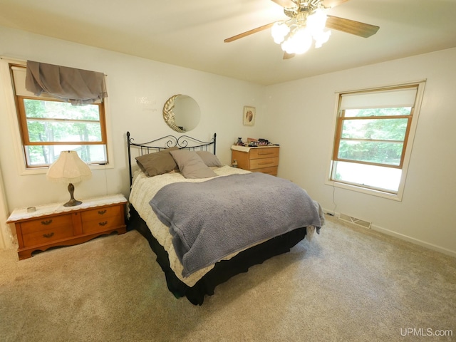 2004 Hunters Ln, Houghton, MI 49931 - carpeted bedroom with a ceiling fan