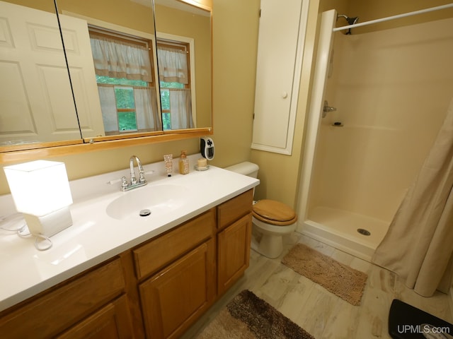 2004 Hunters Ln, Houghton, MI 49931 - bathroom with vanity, wood finished floors, and curtained shower