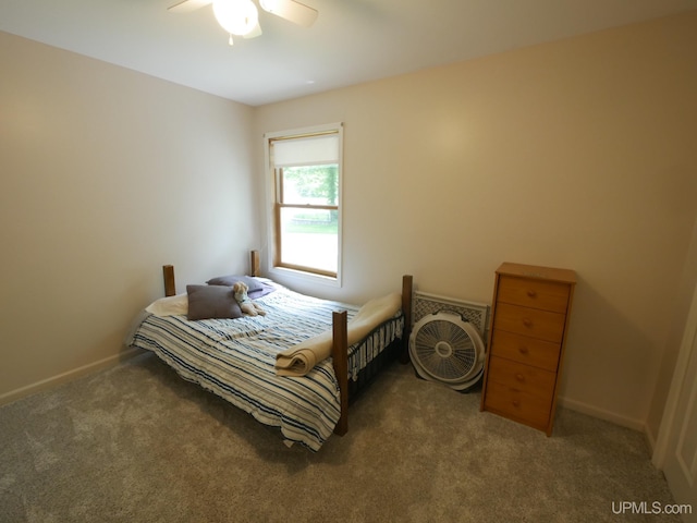 2004 Hunters Ln, Houghton, MI 49931 - carpeted bedroom featuring baseboards and a ceiling fan