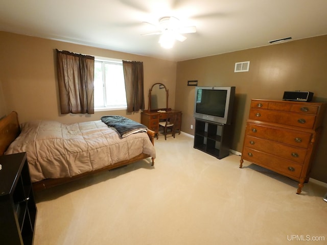 2004 Hunters Ln, Houghton, MI 49931 - bedroom with light colored carpet and ceiling fan