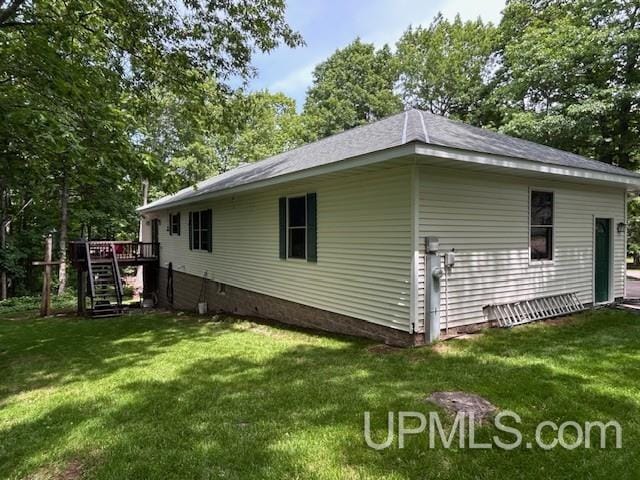 2004 Hunters Ln, Houghton, MI 49931 - view of home's exterior with stairs, a lawn, a deck, and view of scattered trees