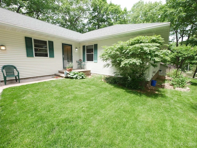 2004 Hunters Ln, Houghton, MI 49931 - view of front of house with a front lawn and a shingled roof