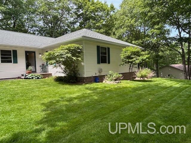 2004 Hunters Ln, Houghton, MI 49931 - view of side of home with a yard